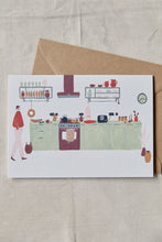 Load image into Gallery viewer, Shop at Settle | Harriet Watson Morning Coffee - charming hand illustrated colour greetings card showing the well-appointed kitchen in Settle's Lakeside Cabin, set on a pale timber background.