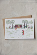 Load image into Gallery viewer, Shop at Settle | Harriet Watson A Walk in the Woods - charming hand illustrated colour greetings card of two guests enjoying a walk in Settle's wooded park, with Carriage No. 2 nestled in the background, set against a pale timber surface.