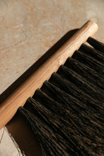 Load image into Gallery viewer, SETTLE | Slow Made Goods - close-up on an oak hand brush with natural bristles against a pale marble background at Settle.