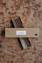 Load image into Gallery viewer, Natural cardboard packet of Autumna incense sticks by Essence + Alchemy, the box lid is open and laid across the box of sticks, which is lying on a natural wooden surface | Settle Norfolk  