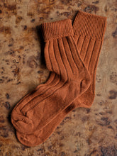 Load image into Gallery viewer, Pair of brown bed socks on a textured wooden surface | Copyright Settle Norfolk UK