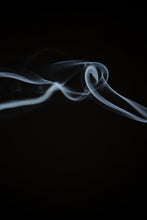 Load image into Gallery viewer, Close-up shot of grey Essence + Alchemy incense smoke against a black background | Settle Norfolk