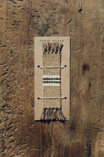 Load image into Gallery viewer, Shop with Settle | Cabin Woven - handwoven from handspun wool bookmark with tasselled ends and central stripe detail; fawn brown with white and charcoal stripe. 