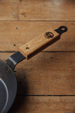 Load image into Gallery viewer, Shop with Settle | Netherton Foundry - close-up on wooden handle of a hand-spun cast iron glamping pan.