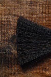 SETTLE | Wild Crafted Home Handmade Hand Brush - close-up on a brushes' dark brown fibres against antique timbers at Settle.