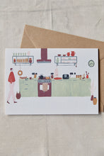 Load image into Gallery viewer, Shop at Settle | Harriet Watson Morning Coffee - charming hand illustrated colour greetings card showing the well-appointed kitchen in Settle&#39;s Lakeside Cabin, set on a pale timber background.    