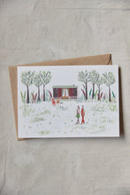 Load image into Gallery viewer, Shop at Settle | Harriet Watson A Walk in the Woods - charming hand illustrated colour greetings card of two guests enjoying a walk in Settle&#39;s wooded park, with Carriage No. 2 nestled in the background, set against a pale timber surface.