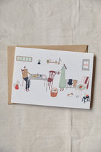 Load image into Gallery viewer, Shop at Settle | Harriet Watson Slow Sunday - charming hand illustrated colour greetings card of two guests enjoying the rustic interior of Carriage No. 1 at Settle, on a pale timber background.    