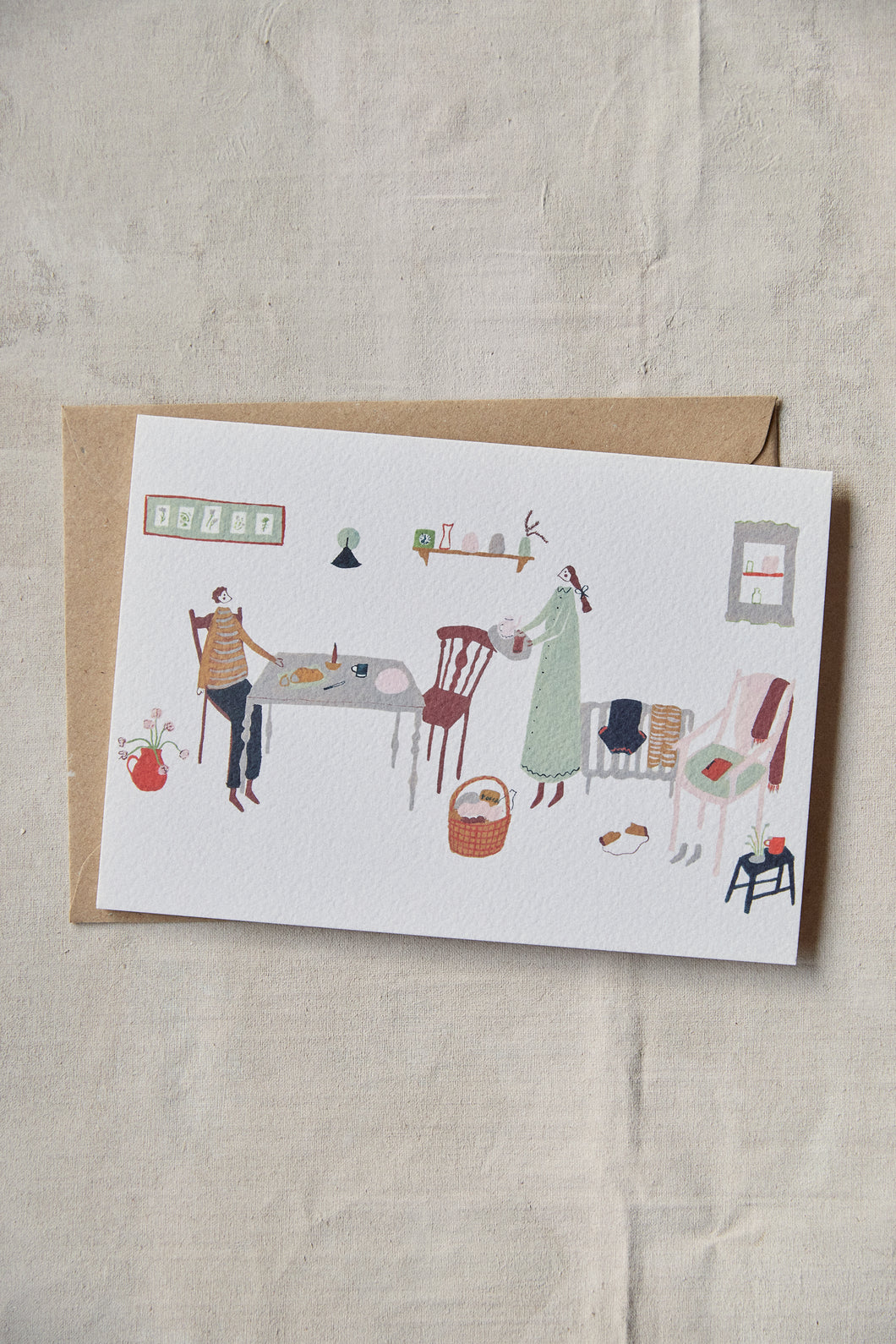 Shop at Settle | Harriet Watson Slow Sunday - charming hand illustrated colour greetings card of two guests enjoying the rustic interior of Carriage No. 1 at Settle, on a pale timber background.    