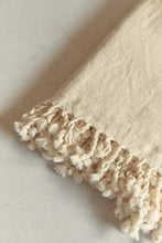 Load image into Gallery viewer, SETTLE | Pico Goods Hand Towel - close-up of a handwoven organic cotton hand towel with tasselled edging in a natural off-white at Settle.